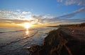 Shoreline at sunset, Puerto Cabopino, Spain.