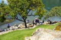 Mayan women wash clothes on the shores of Lake Atitlan Guatemala.