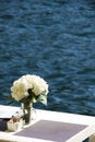 Shoreside table setting with blurred sea Royalty Free Stock Photo