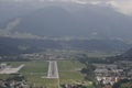 Landing aircraft between mountains - pilot view Royalty Free Stock Photo