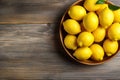 Short food supply chains SFSCs.From garden to plate concept.A bowl of fresh lemons on the wood table.Flat lay,Copy space