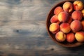 Short food supply chains SFSCs.A bowl of fresh peaches on the wood table. Flat lay, Copy space
