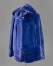 Short fur coat, avtoledi, bright blue with a hood, sleeves are decorated with longitudinal strips of fur. Vertical frame