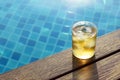 A short glass of ice beer at pool Royalty Free Stock Photo