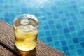 A short glass of ice beer at pool Royalty Free Stock Photo