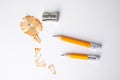 Short graphite pencils, shavings and sharpener on background, top view Royalty Free Stock Photo