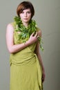 Short hair brunette woman with green dress