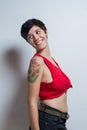 Short-hair brunette woman wearing a red tank top, smiling Royalty Free Stock Photo