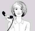 Short-haired blonde girl holds in her hand a black tube of a retro phone Royalty Free Stock Photo