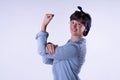 Short-haired girl showing strong arm muscle isolated Royalty Free Stock Photo