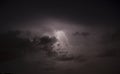 Short lightning bolt in night clouds Royalty Free Stock Photo