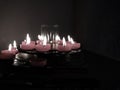 Short Lit Religious Candles In Dull Light Royalty Free Stock Photo