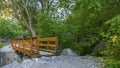 Short and narrow wood bridge in Provo Utah forest