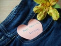 Short note on sticky paper with heart shape, happy father`s day on jeans Royalty Free Stock Photo