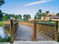 Short pedestrian zigzag wooden bridge over a small river