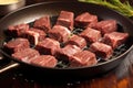 short ribs on a skillet being infused with a baste Royalty Free Stock Photo