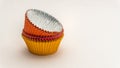 Short stack of Colorful cupcake wrappers stacked upside right on a white background Royalty Free Stock Photo