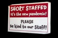 Short Staffed Sign on Black