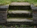 Short stairs  in quarrystone with weeds overgrown Royalty Free Stock Photo