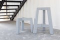 Short and tall grey wooden stool or chair legs Royalty Free Stock Photo
