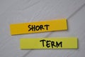 Short Term text on sticky notes isolated on office desk