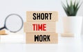 SHORT TIME WORK. text on wooden block Royalty Free Stock Photo