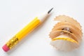 Short yellow pencil on textured white paper Royalty Free Stock Photo