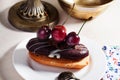 Shortbread cake with chocolate eclair a cherry Royalty Free Stock Photo