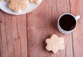 Shortbread cookies with meringue in the form of a flower, on a light wood background Royalty Free Stock Photo