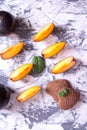 Shortbread cookies in the shape of a heart and plum slices with mint