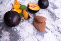 Shortbread cookies in the shape of a heart and plum slices with mint