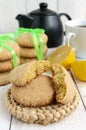 Shortbread lemon flavored cookies: a broken and connected green ribbon for a gift. Royalty Free Stock Photo