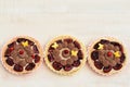 Shortbread tartlets decorated with whipped ganache and fruits