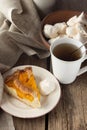 Shortcrust peach pie, meringues and cup of tea Royalty Free Stock Photo