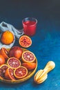 Shorts of alcohol cocktail with Sliced Sicilian Blood oranges and fresh red orange juice Royalty Free Stock Photo