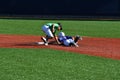 A shortstop tagging a runner at second trying to steal the base