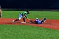 A shortstop tagging a runner at second trying to steal the base