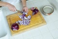 Red onions being sliced and diced on cutting board with a wide-angle view overhead Royalty Free Stock Photo