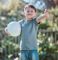 Good job, I turned out perfectly. Shot of an adorable little boy showing the thumbs up while holding a soccer ball