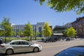 A shot along Market Street with office buildings, retail stores and restaurants, cars and trucks driving on the street