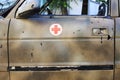 Shot ambulance at the scene of hostilities. Bullet holes in metal Royalty Free Stock Photo