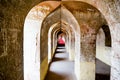 Shot of an arched hallway of an ancient building