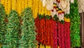 Shot of an array of different flower garlands hanging in a flower shop.