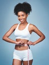 Im losing more than Ive bargained for. Shot of an attractive young woman measuring her waist against a grey background.