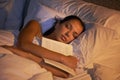 She fell asleep reading again. Shot of an attractive young woman sleeping holding book.