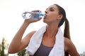 Water is all you need to keep you going. Shot of an attractive young woman working out. Royalty Free Stock Photo