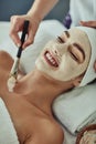 What a blissful experience. Shot of an attractive young woman getting a facial at a beauty spa.