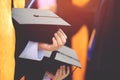 Shot back side young female of graduation hats during commencement