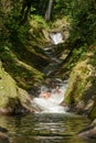 Taveuni Island, Fiji - 06 27 2014: Tourists sliding down the Waitavala Natural Rock Waterslide