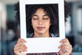 Beautiful afro business woman holding hands frame while posing to camera to snapshot in the office at home